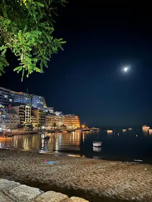 a view of a river at night with a moon at Apartmani Jedro in Rafailovici