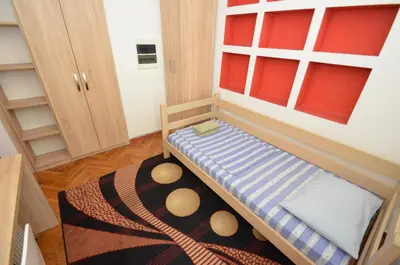 a small room with a bunk bed in a room at Bugi in Kotor
