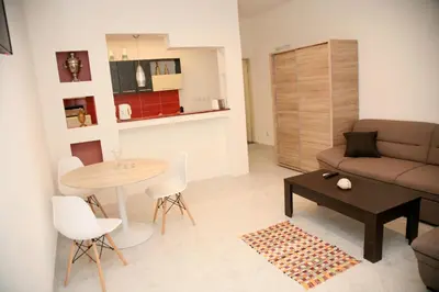 a living room with a couch and a table at Bugi in Kotor