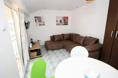 a living room with a couch and a table at Bugi in Kotor