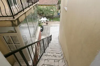 a view of a balcony with a table on a patio at Bugi in Kotor