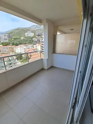 an empty balcony with a view of a city at Belveder Montenegro in Rafailovici