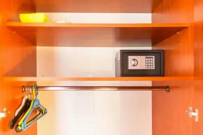 a microwave sitting on a shelf in a kitchen at Guest House Mandarina in Budva