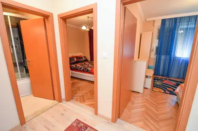 a room with a bedroom with a bed in it at Central Apartment in Kotor