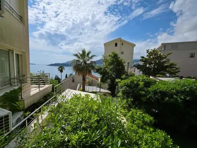 a view of the water from between two buildings at Meridian Hotel in Budva