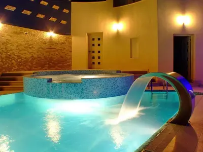 a hot tub with a water fountain in a building at Meridian Hotel in Budva