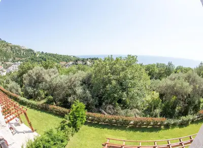 an aerial view of a garden with benches and trees at Townhouse Virginia in Petrovac na Moru