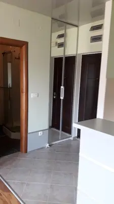 a room with glass doors and a tile floor at Апартаменты Ирина М in Bar