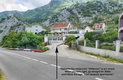 an image of a street with houses on the side of the road at Four Seasons Apartments in Kotor