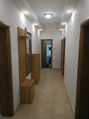 a hallway of a room with wooden furniture at Apartment Misulino in Kotor