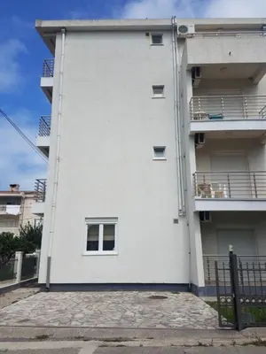 a white apartment building with a balcony at Villa Swan in Bar