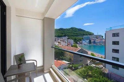 a balcony with a view of the ocean at Apartments Djuro Rafailovic in Budva