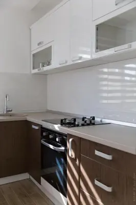 a kitchen with a stove and a counter top at Apartments Sunny Hill in Tivat