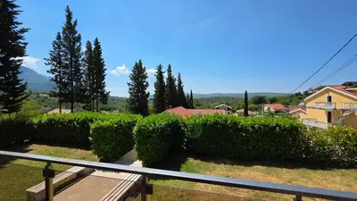 a view of a hedge from a balcony at Apartments Sunny Hill in Tivat