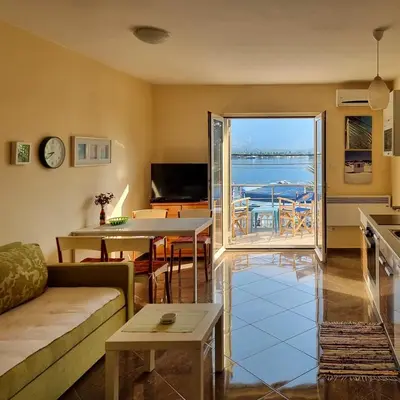 a living room with a view of the ocean at Luxury Apartment Maja in Tivat