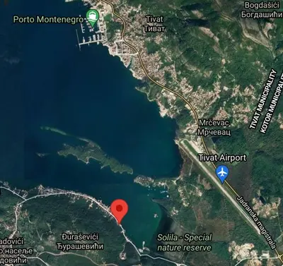 a map with a red circle in the middle of a lake at Luxury Apartment Maja in Tivat