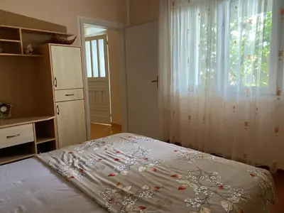 a bedroom with a bed and a window at Luka Apartment in Ulcinj