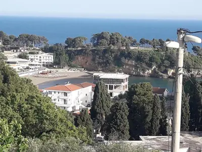 a view of a town with the ocean in the background at Luka Apartment in Ulcinj