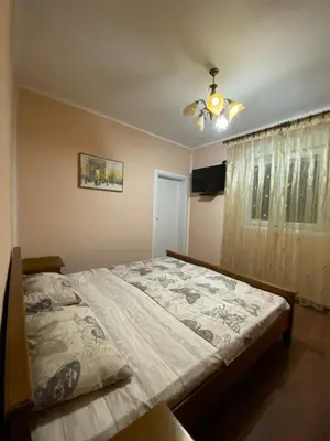 a bedroom with a bed and a ceiling fan at Luka Apartment in Ulcinj