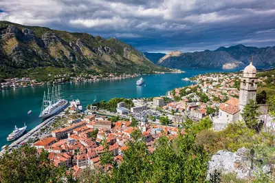 a view of a town with boats in the water at Guesthouse Nikoleta in Kotor