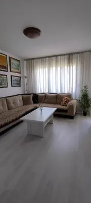 a living room with a couch and a coffee table at Royal Apartment Bar in Bar