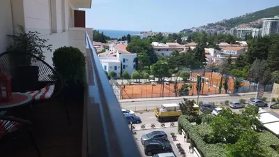 a balcony with a view of a city street at Red Lux in Budva