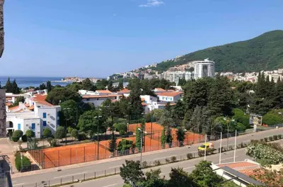 a view of a city with a road and buildings at Red Lux in Budva