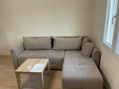 a living room with a couch and a coffee table at Apartment Lazar & Marco in Podgorica