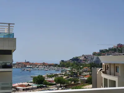 a view of a harbor with boats in the water at Apartments Menuet in Budva