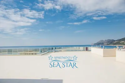 a sign that reads mermaids sea star on a beach at Sea Star Apartment in Dobra Voda