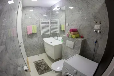 a bathroom with a toilet and a sink and a shower at Apartman Anna Tre Canne Budva in Budva