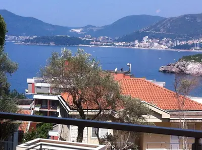 a view of a large body of water with buildings at Apartment Galina Przno in Budva