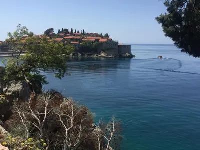 a house on an island in the middle of the water at Apartment Galina Przno in Budva
