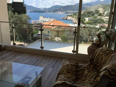 a living room with a view of a large window at Apartment Galina Przno in Budva