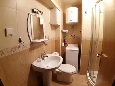 a bathroom with a sink and a toilet and a shower at Ana in Budva