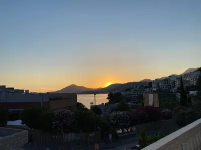 a view of the sunset from a city at Apartmani Kažanegra33 in Pržno