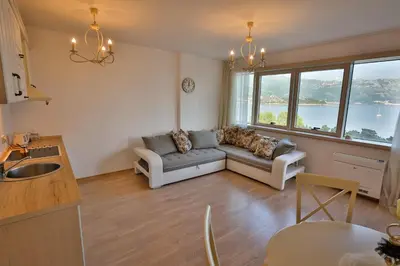 a living room with a couch and a table at Miracle in Budva