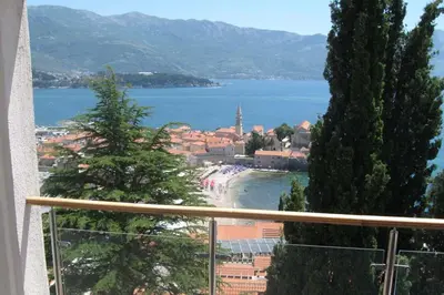 a view of a beach from a balcony at Apartmani Katarina in Budva