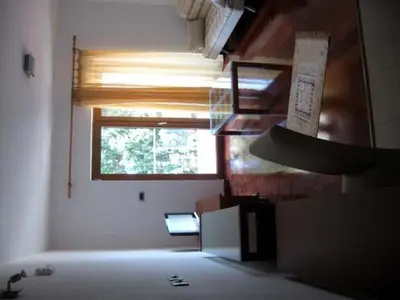a room with a room with a window and a staircase at Apartmani Katarina in Budva