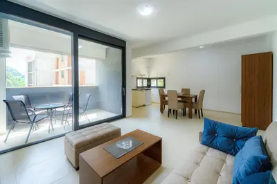 a living room with a couch and a table at N Apartments in Sutomore