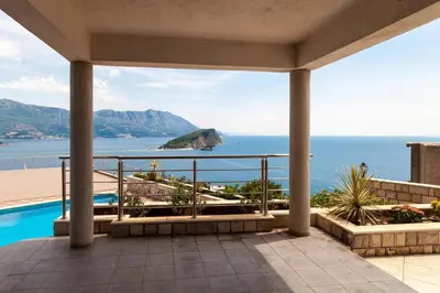 a view of the ocean from the balcony of a house at Vidikovac Marble House in Budva