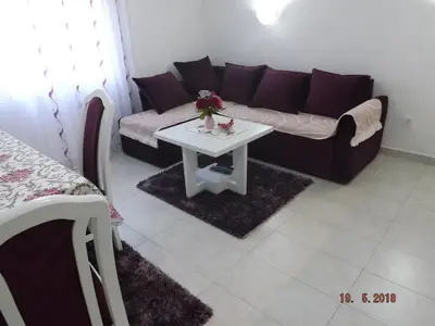 a living room with a couch and a table at Raj in Kotor