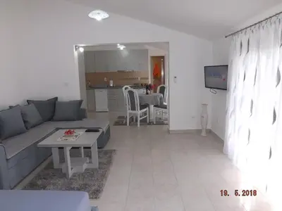 a living room with a couch and a table at Raj in Kotor