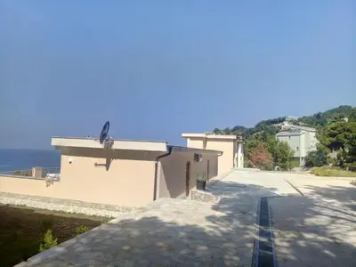 a view of a building with the ocean in the background at Villa Roan in Bar