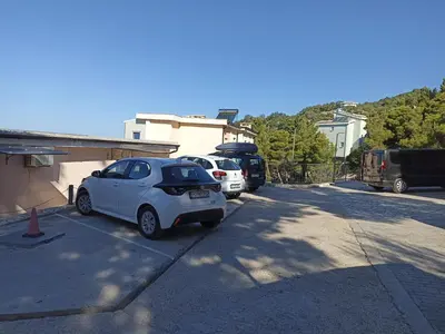 a small white car parked in a parking lot at Villa Roan in Bar