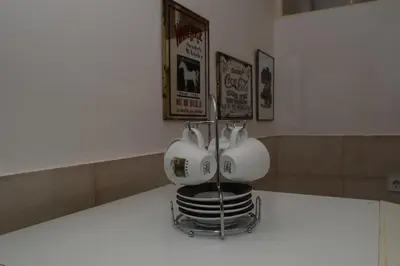a pair of tea cups sitting on a counter at Apartment Monika in Kotor