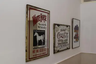 three framed posters hanging on a wall at Apartment Monika in Kotor