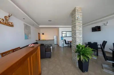 a living room with a kitchen and a dining room at Apartmani Djurovic in Dobra Voda