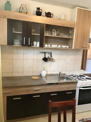 a kitchen with a sink and a stove at Guest house Duletic in Budva