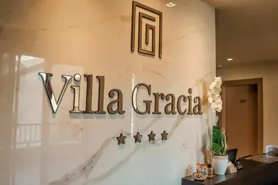 a sign that reads villa gracia on a wall at Hotel Villa Gracia in Budva